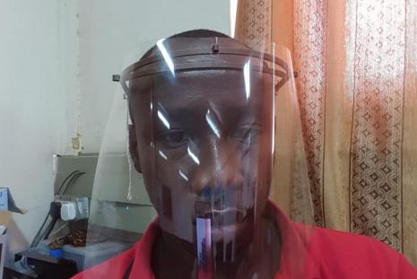 Assembled face shield in use for protection against contamination of covid-19 virus.